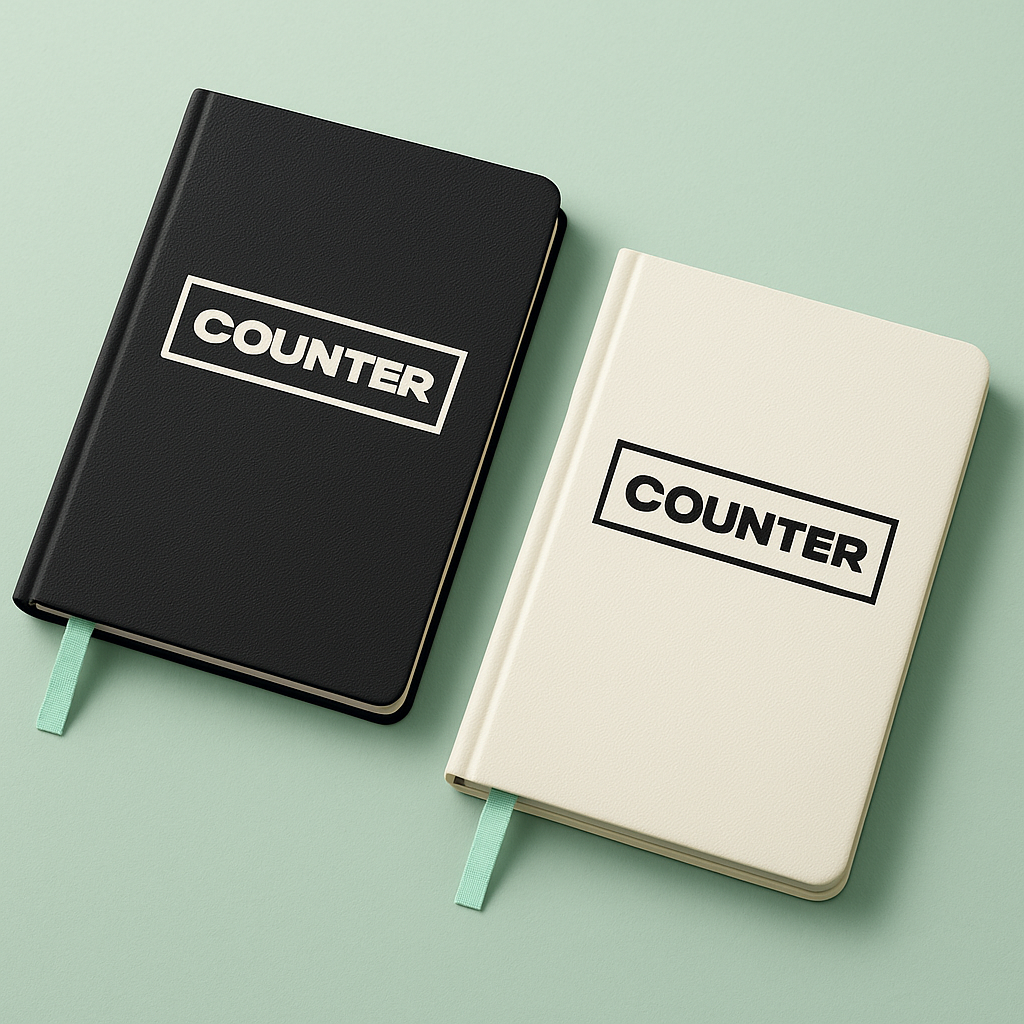 Counter Haus A5 hard-cover dot-grid journals in charcoal and cream